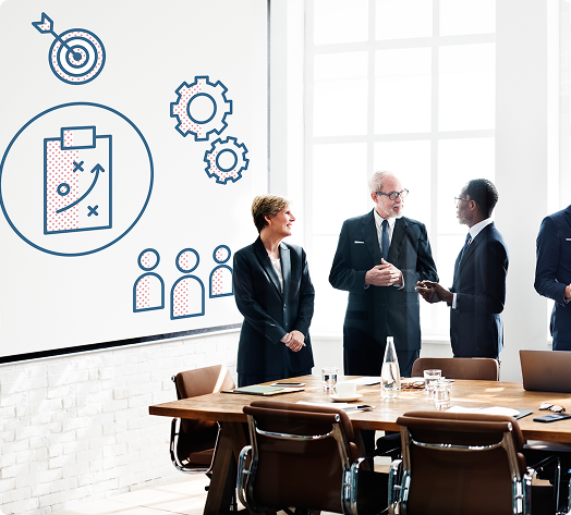 Team discussing numbers and flow in front of a presentation board