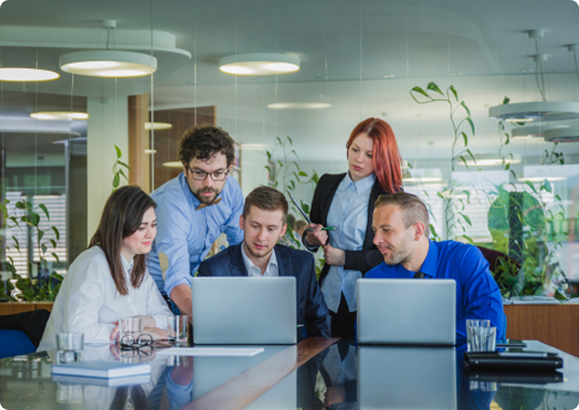 Two business professionals having strategic discussion at meeting table