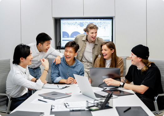 Two business professionals having strategic discussion at meeting table