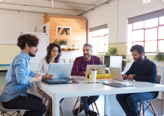 Two business professionals having strategic discussion at meeting table