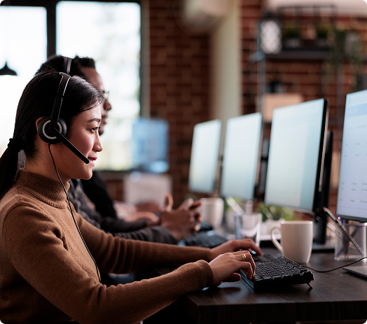 Business professional presenting to team in meeting room