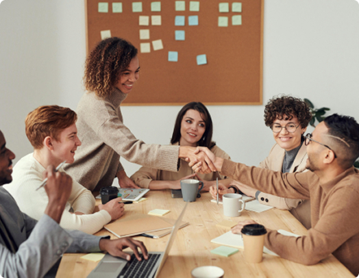 Team discussing numbers and flow in front of a presentation board