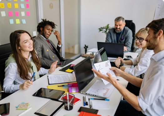 Two business professionals having strategic discussion at meeting table