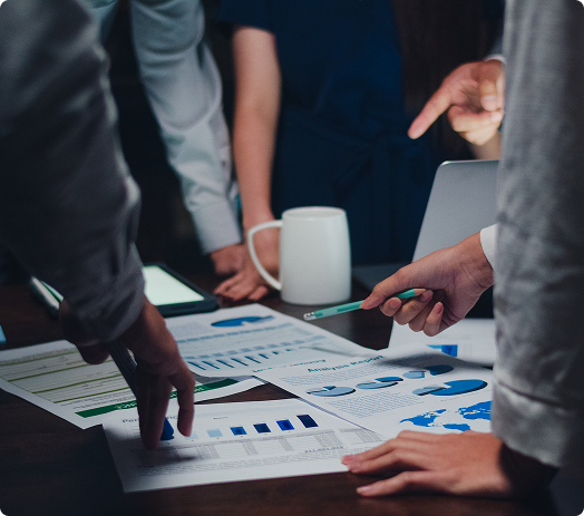 Business professional presenting to team in meeting room