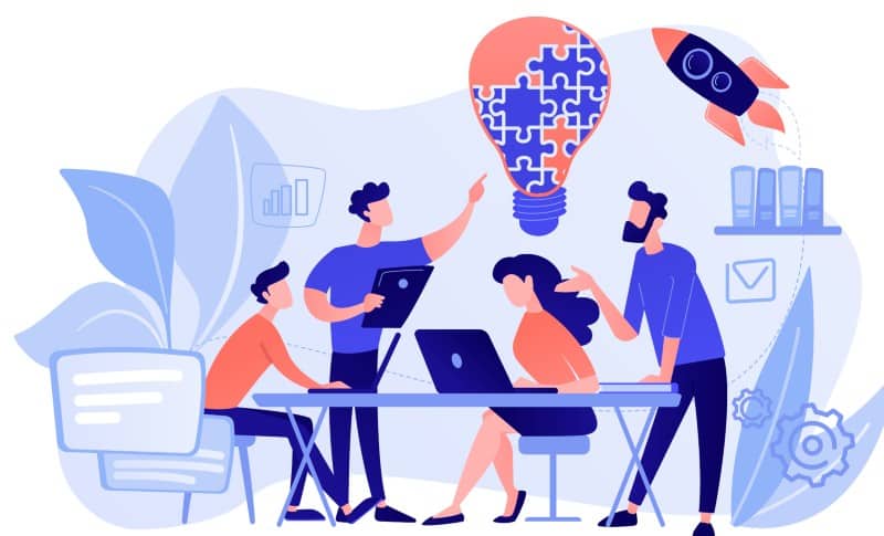 development-team Startup stories, Business guides & Marketing | Codeventures Blog Team of four collaborating around a table with laptops, a lightbulb made of puzzle pieces overhead, blue-toned illustration (brainstorming)